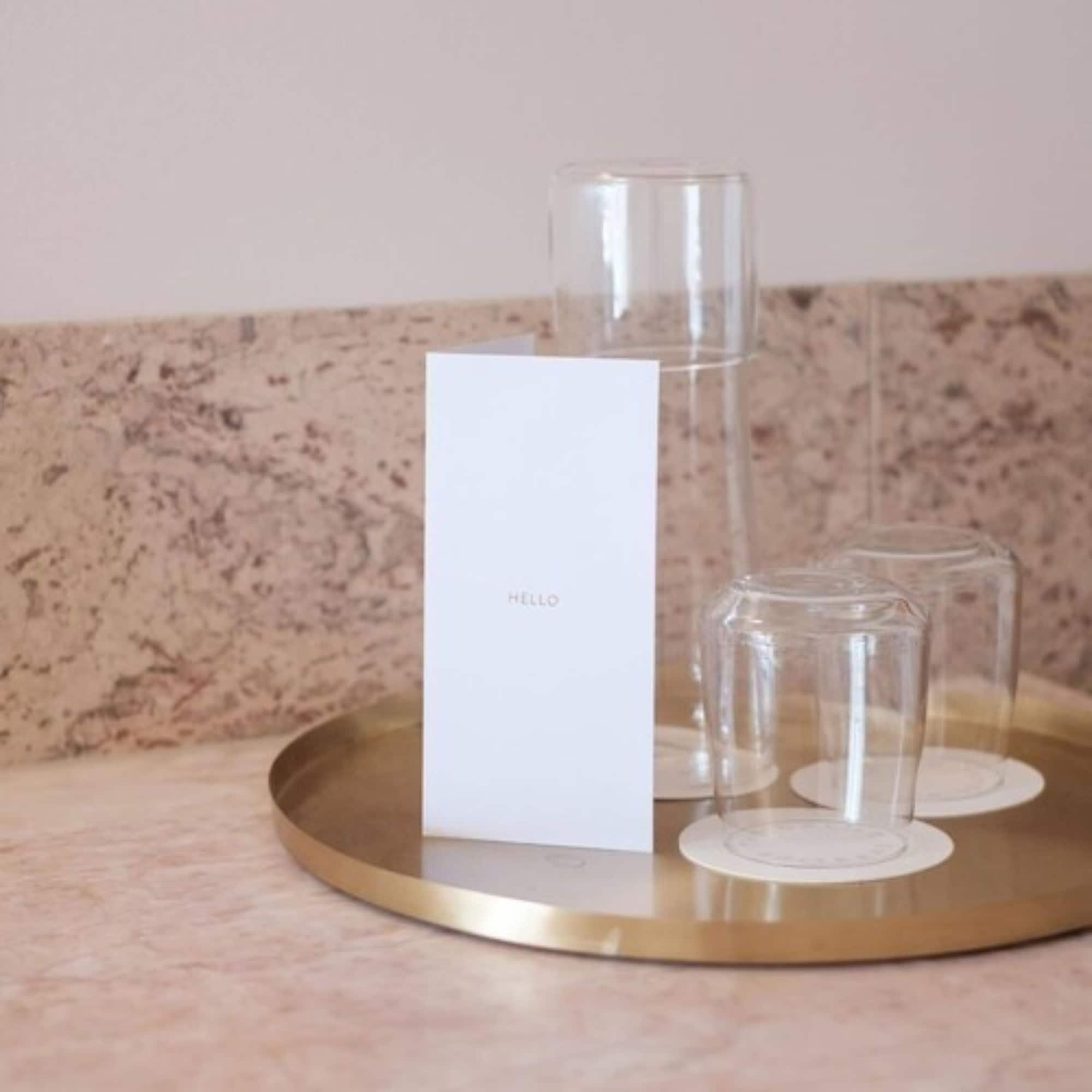 The Calile Hotel Бризбейн Екстериор снимка A tray of water and glasses at a hotel